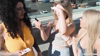 Two sexy girls are having fun on the strip, playing with each other