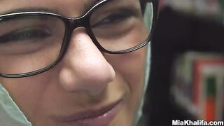 Mia Khalifa masturbates in the library, showcasing her massive boobs