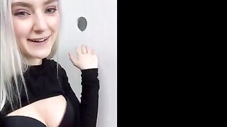 A girl received a cumshot on her face through the glory hole in the fitting room