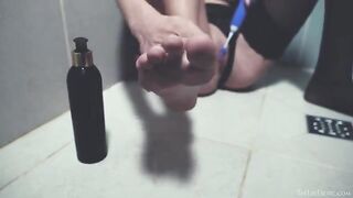 A woman washes her pussy in the shower and caresses it