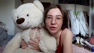 A young, naughty girl gets her tight pussy wet with a teddy bear