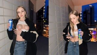 A cute girl showed more than her boobs for a can of energy drink