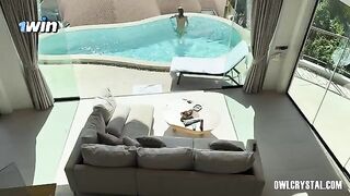 A beautiful woman enjoys her vacation alone in the pool