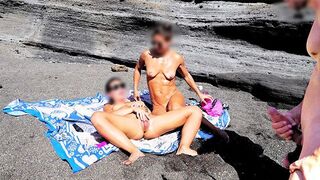 A girl shows her boobs to the guy on the beach