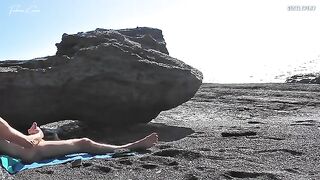 A girl shows her boobs to the guy on the beach