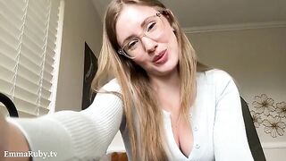 A girl with glasses applies lipstick, showcasing her sexy side in a soothing ASMR session inspired by Emma Ruby’s relaxing POV content
