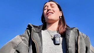 A petite brunette babe masturbating outdoors on a mini skirt