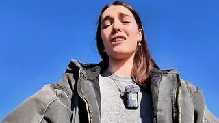 A petite brunette babe masturbating outdoors on a mini skirt